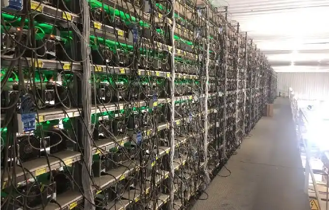 ASIC miner on a repair bench with tools