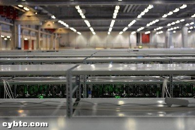 A large-scale mining farm with rows of mining rigs and advanced cooling infrastructure.